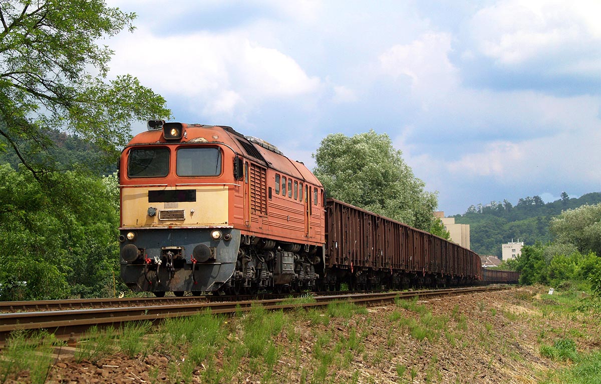 Long freight train hauled by a powerful Diesel locomotive